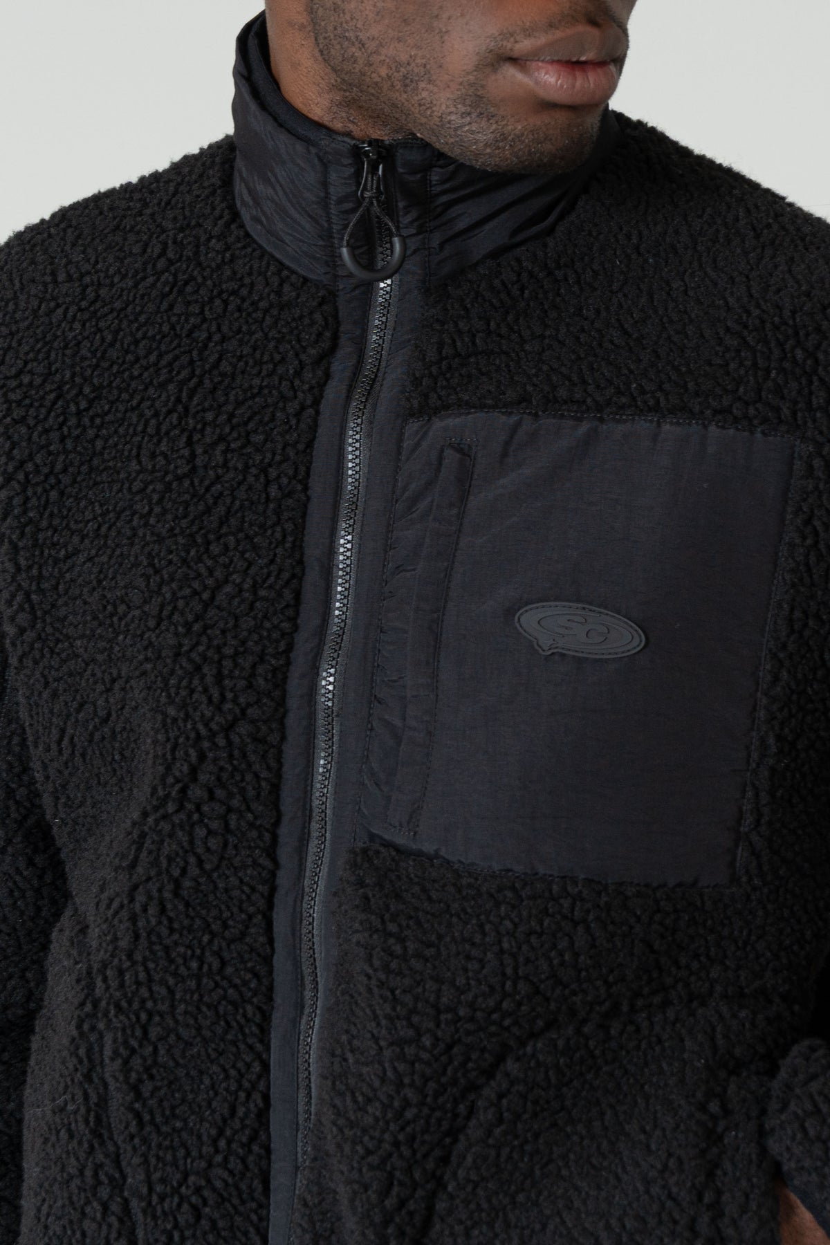 Leonardo Zip Thru Borg Black
